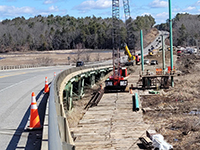 Construction of the temporary Station 46 Bridge and roadway, looking north towards George Wright Rd. from existing Station 46 Bridge.